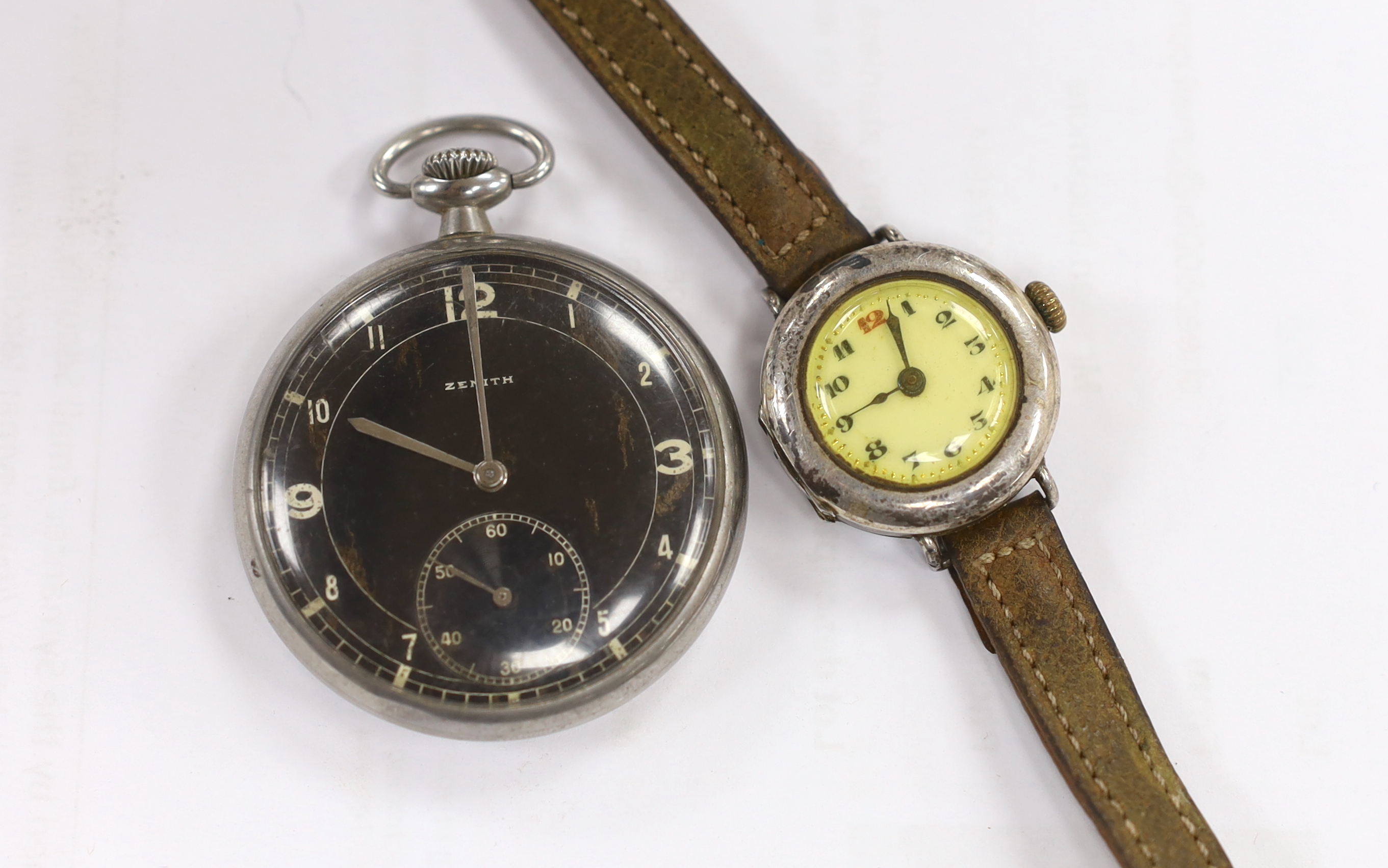 A chromium cased Zenith black dial keyless pocket watch and a silver wrist watch.
